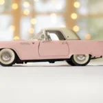 Car buyer reviewing bid costs beside a sedan at an auction lot